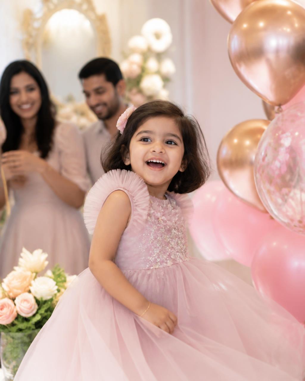 Child laughing at her birthday party